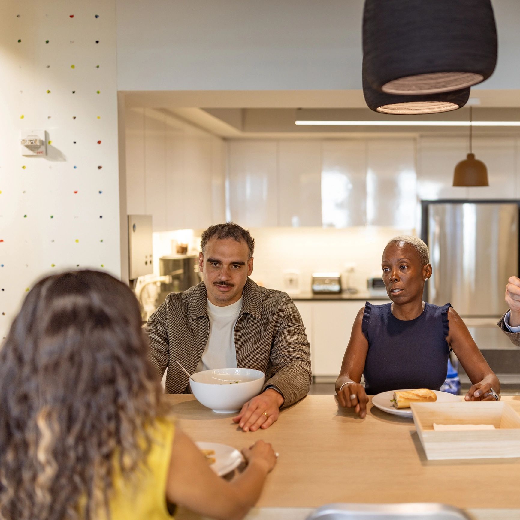 Happy dining guests enjoying a chef-prepared meal